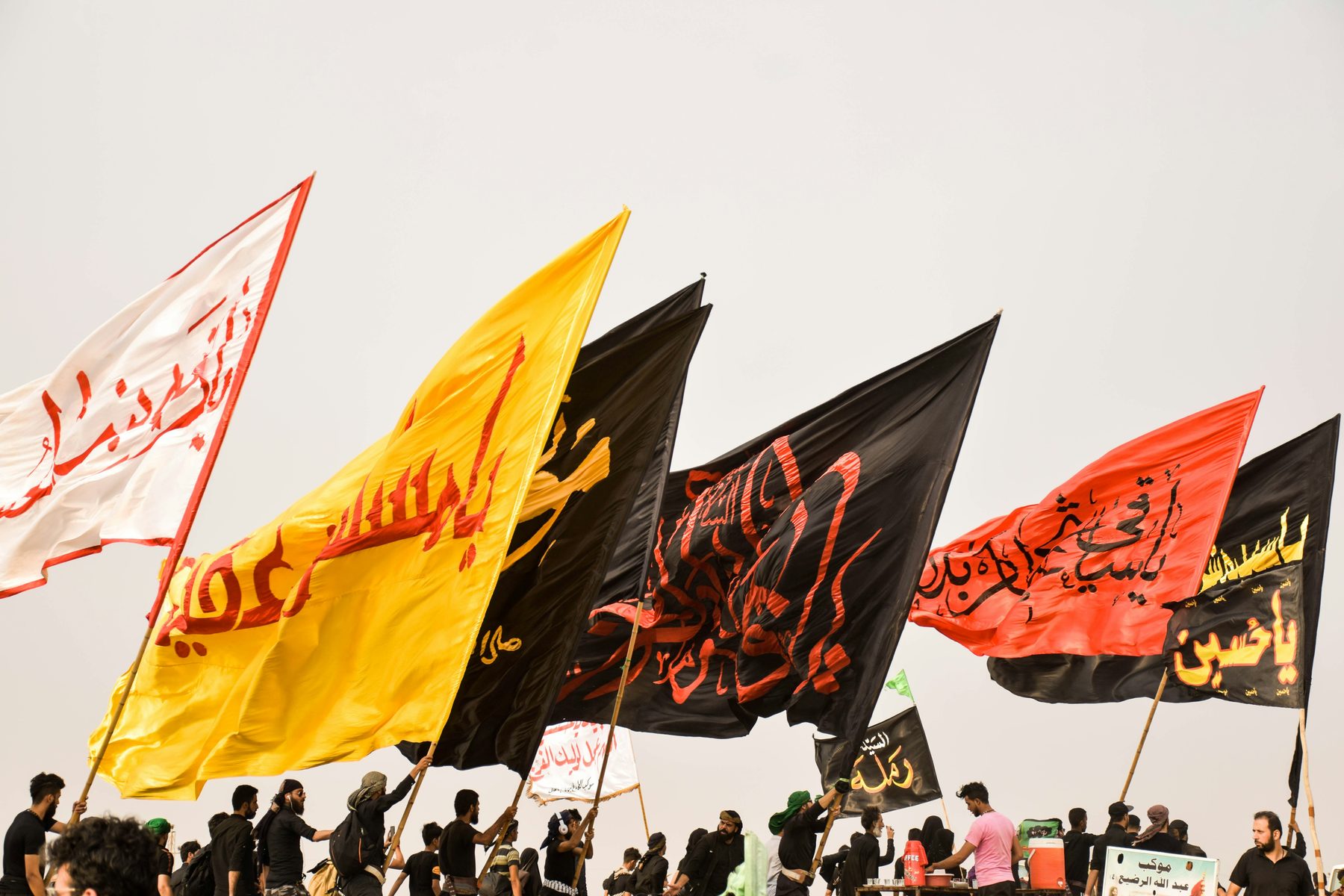 Azadari flags raised during a devotional walk